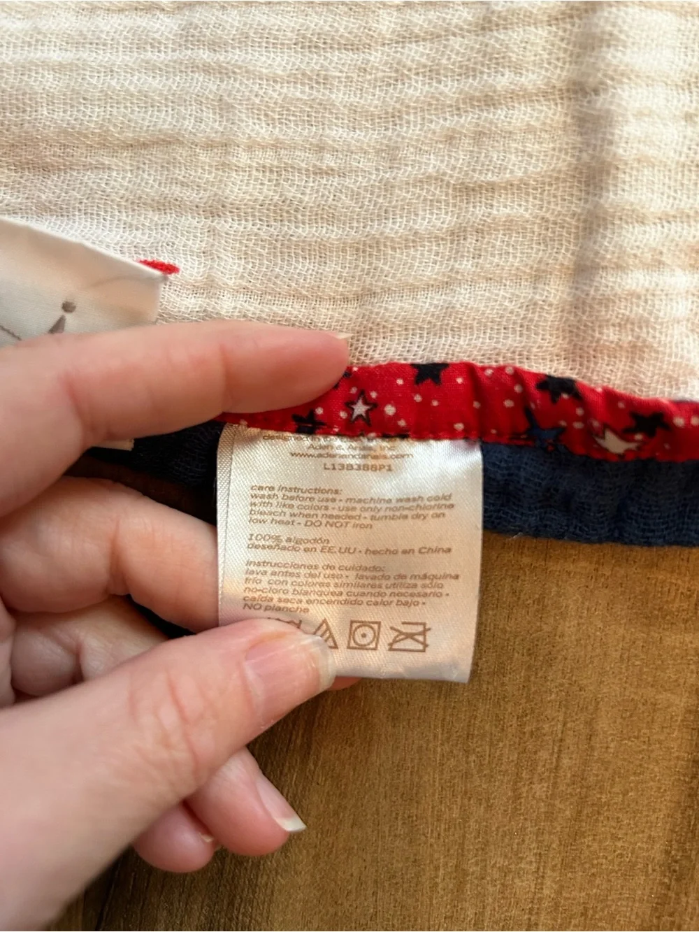 aden + anais Red Star Muslin Baby Blanket on White